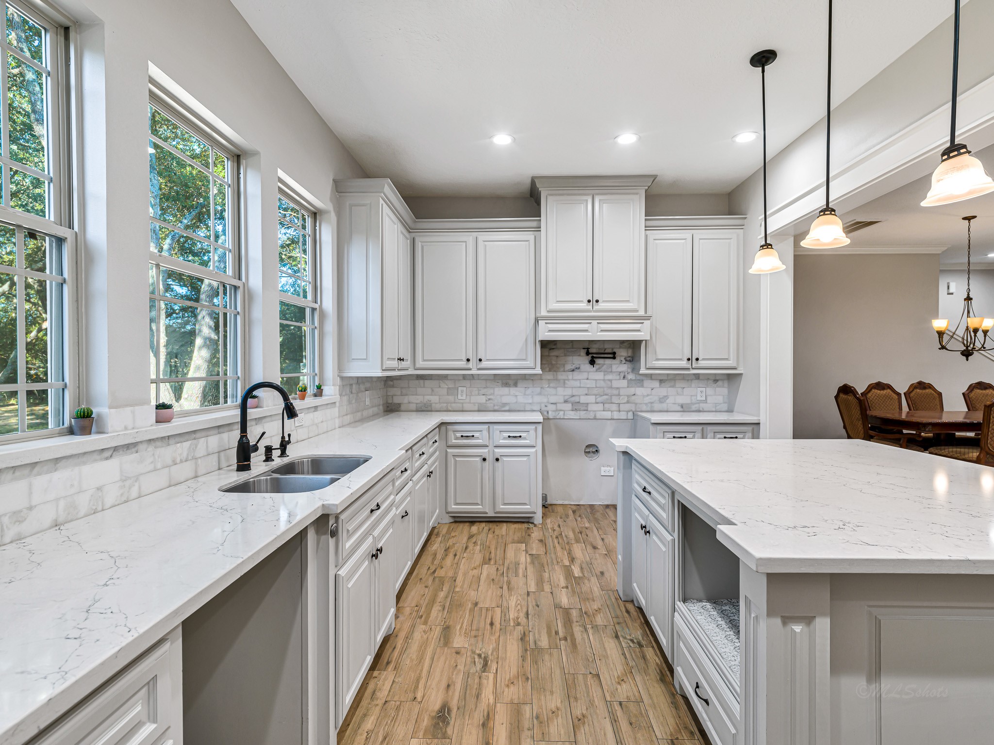 18117 FM 762 Road Needville, TX 77461 - Photo 9 of 37 a kitchen with a sink stove and cabinets