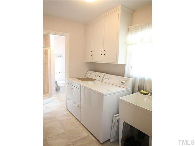 1337 Cole Mill Road Durham, NC 27705 - Photo 16 of 20 enter through eat in kitchen, leads to full bathroom Laundry Room