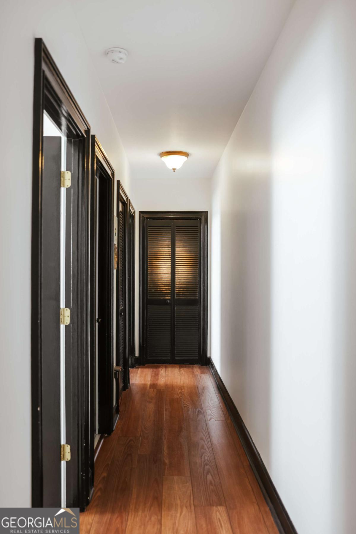 247 West Washington Street, Unit 504 Athens, GA 30601 - Photo 14 of 34 a view of hallway with wooden floor