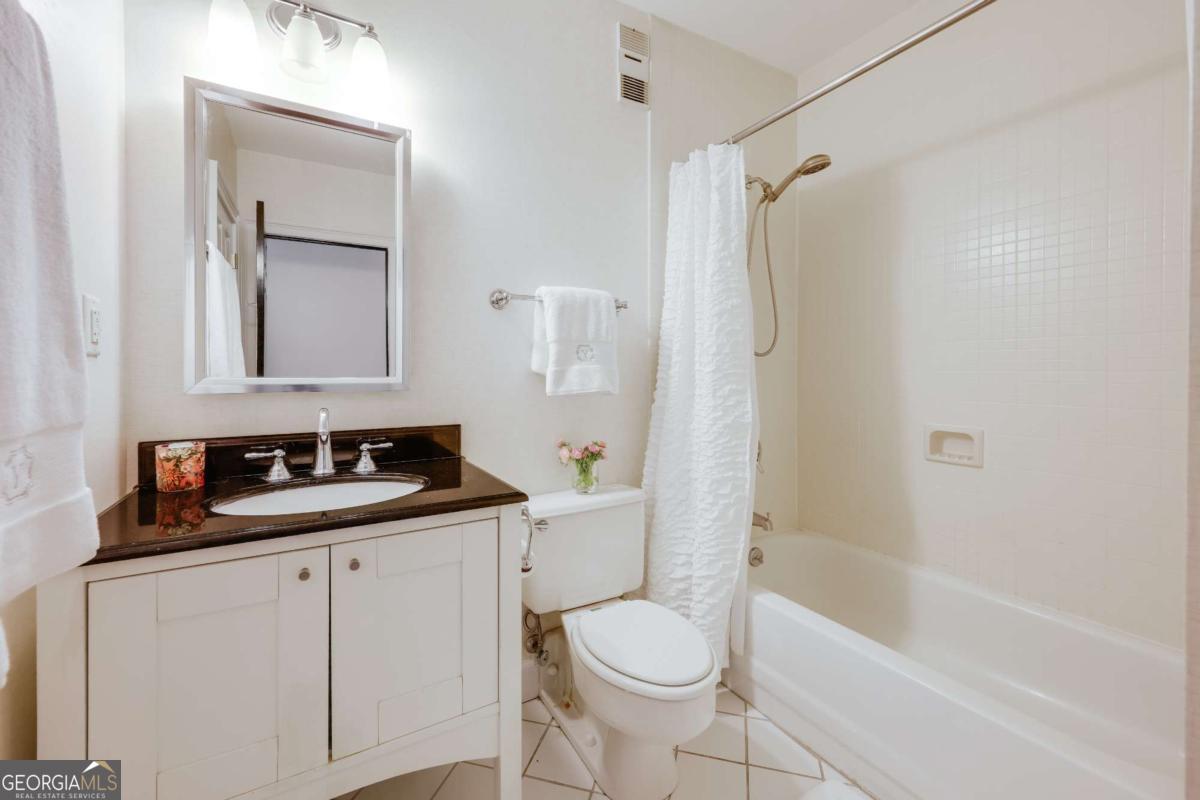 247 West Washington Street, Unit 504 Athens, GA 30601 - Photo 20 of 34 a bathroom with a sink toilet and shower