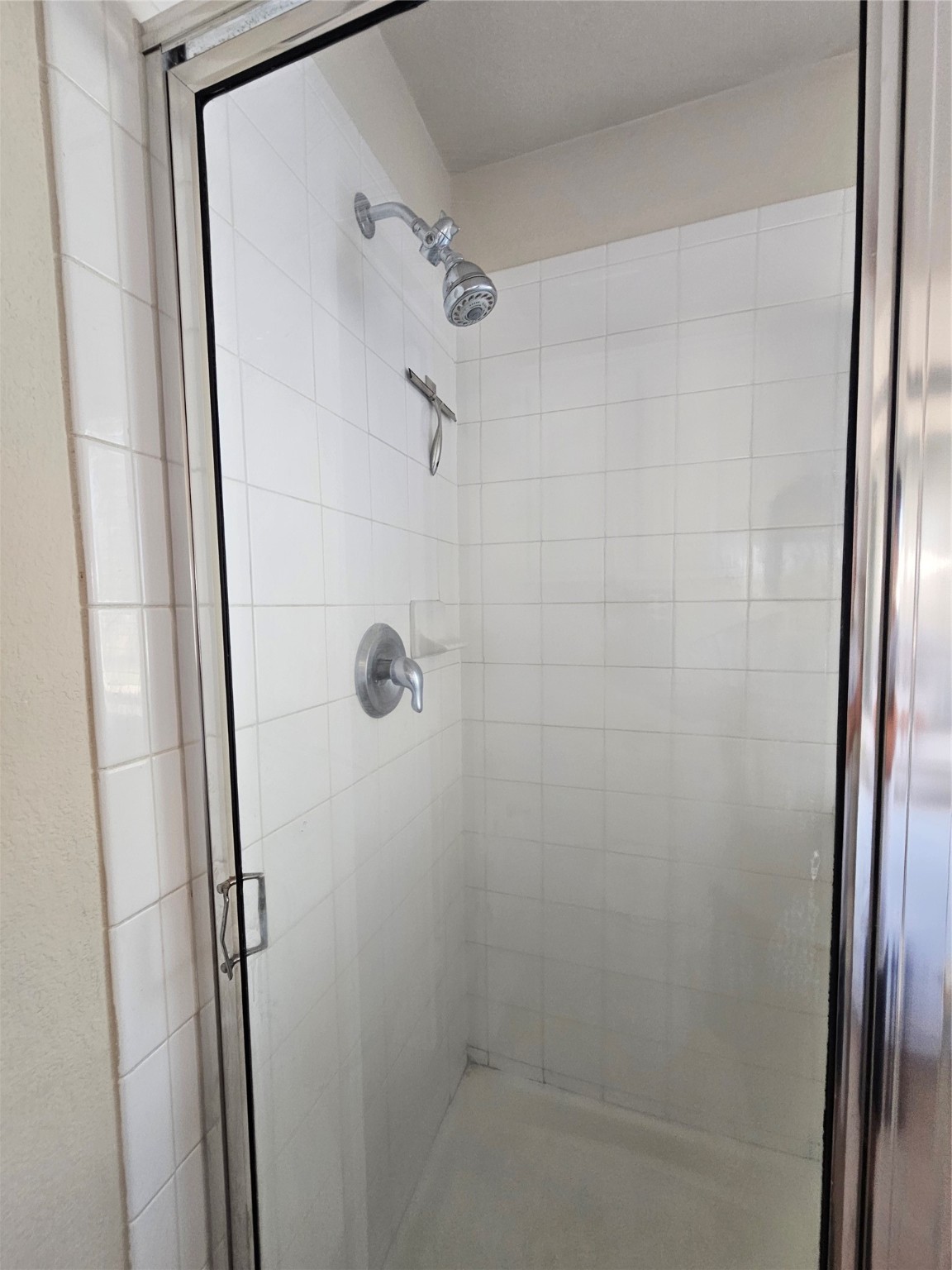 13231 Barrow Point Lane Houston, TX 77014 - Photo 13 of 27 a bathroom with a shower