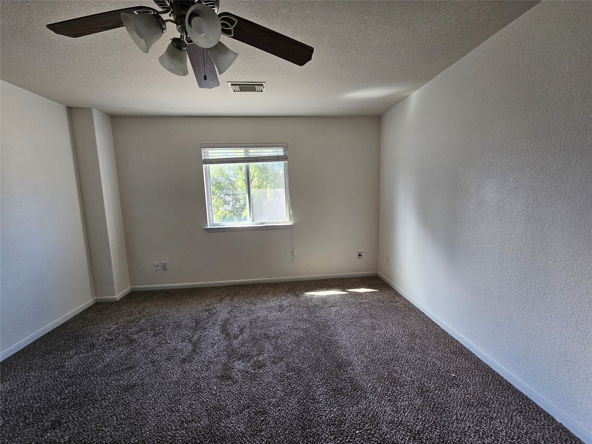 13231 Barrow Point Lane Houston, TX 77014 - Photo 16 of 27 a view of an empty room and a window