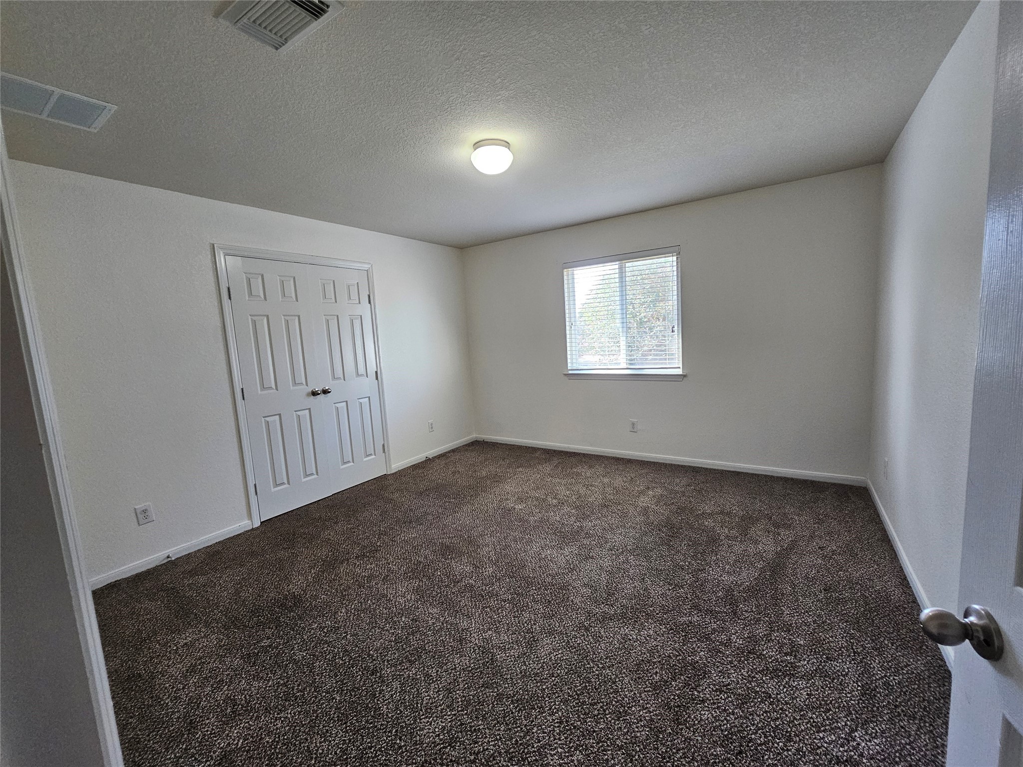 13231 Barrow Point Lane Houston, TX 77014 - Photo 17 of 27 an empty room with windows