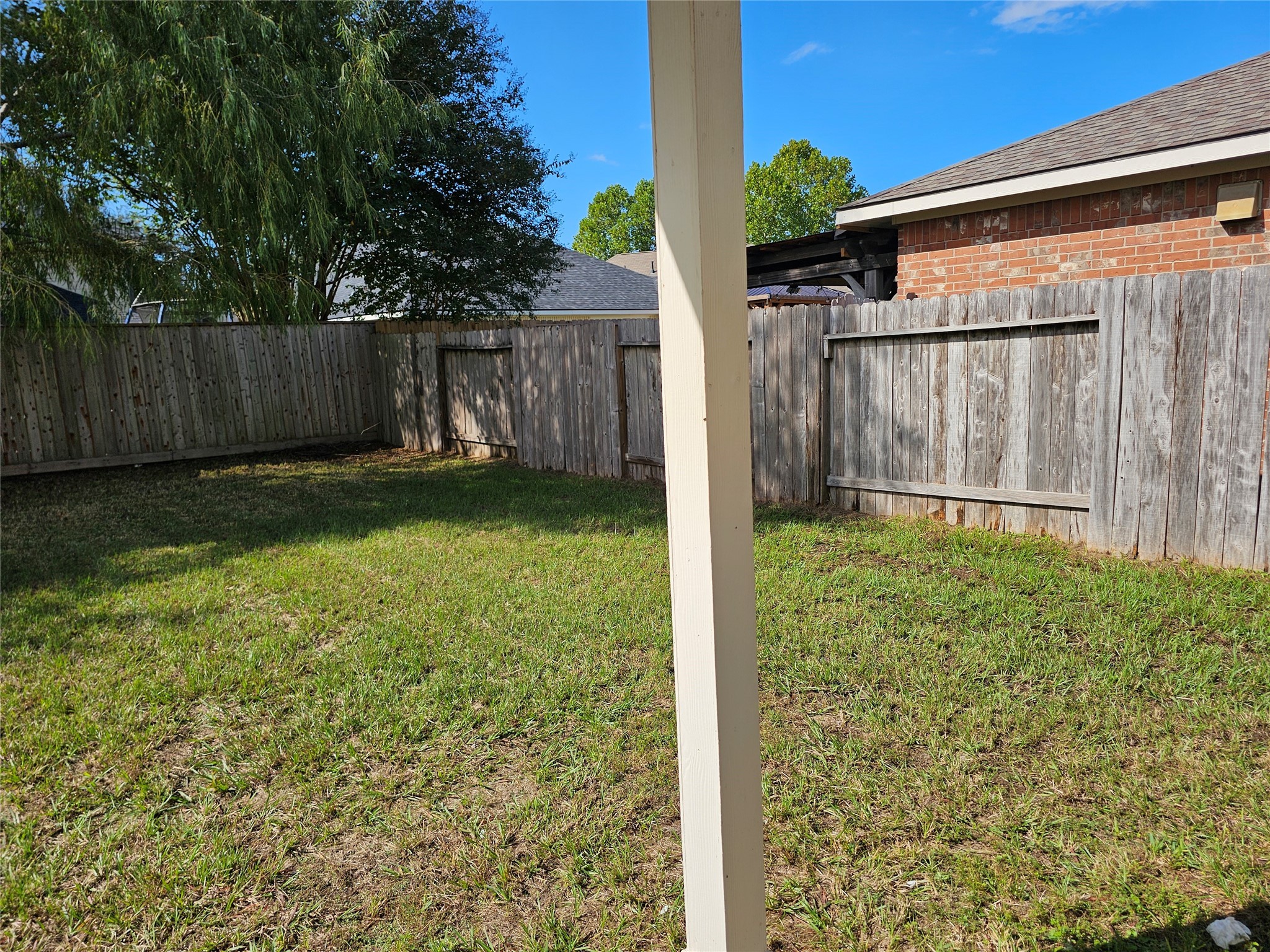 13231 Barrow Point Lane Houston, TX 77014 - Photo 26 of 27 a view of a backyard with a small cabin