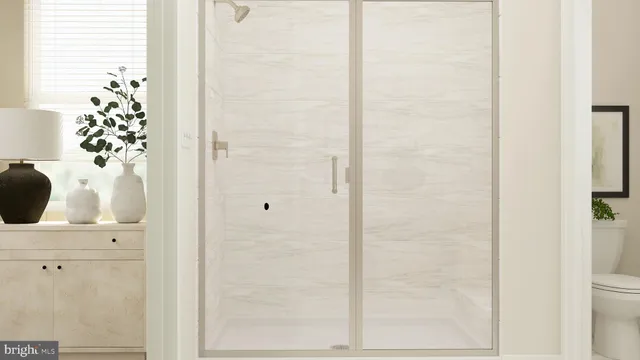 a bathroom with a bathtub and shower