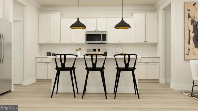 a view of kitchen with furniture and wooden floor