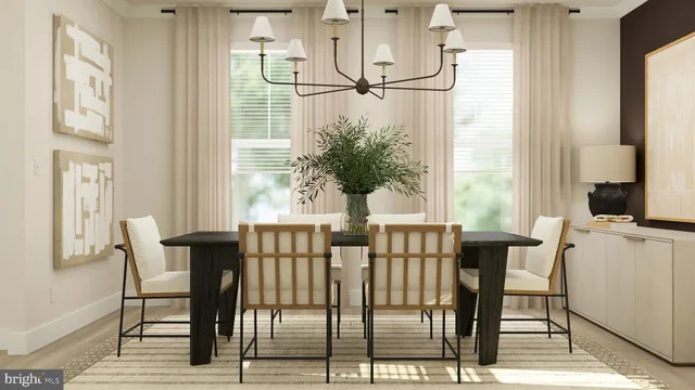 a view of a dining room with furniture and a potted plant