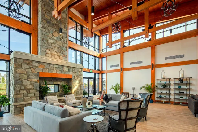 a building outdoor space with patio the couches and potted plants