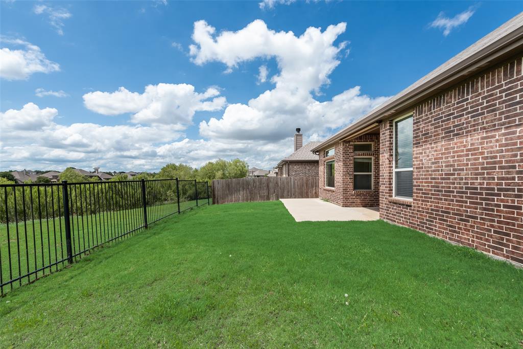 9641 Calaveras Road Fort Worth, TX 76177 - Photo 23 of 23 a view of a backyard with a garden
