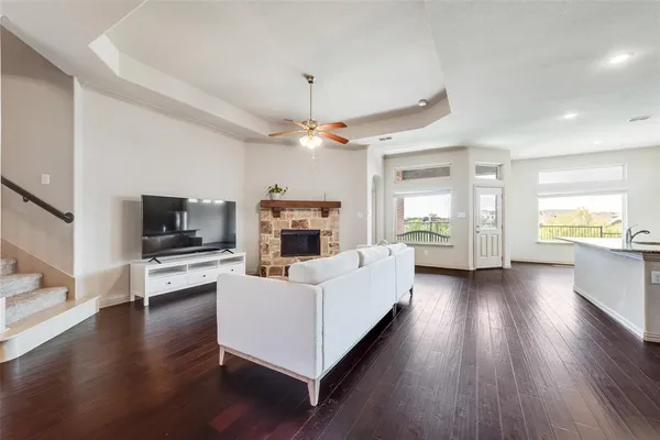 a living room with furniture fireplace and flat screen tv