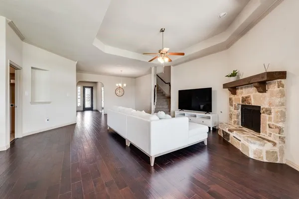 a living room with furniture fireplace and flat screen tv