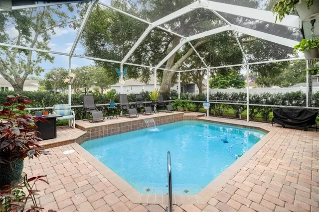 a view of a swimming pool with a patio