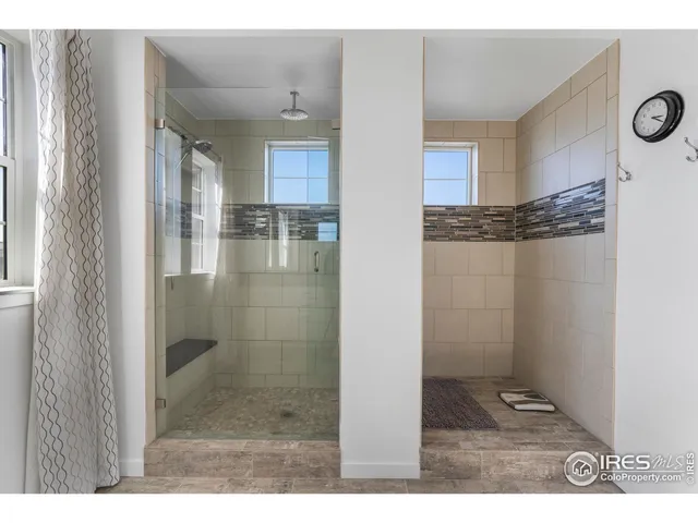 a bedroom with a bed next to a window