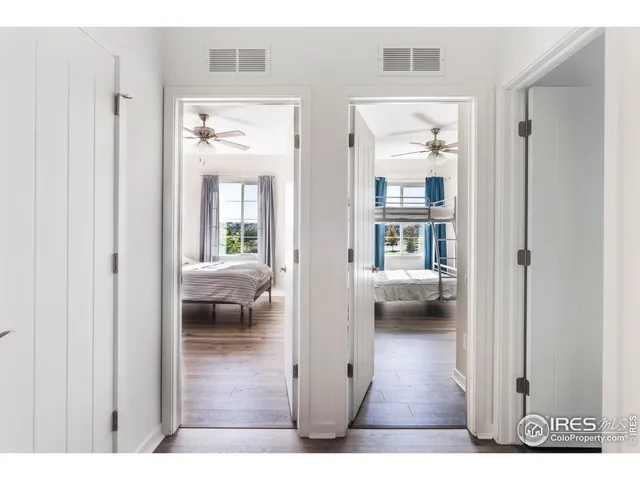 a bedroom with a bed and cabinet