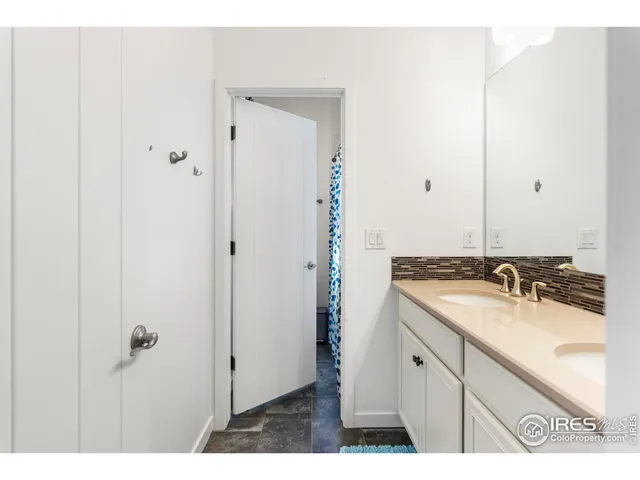 a view of a livingroom with furniture wooden floor and windows