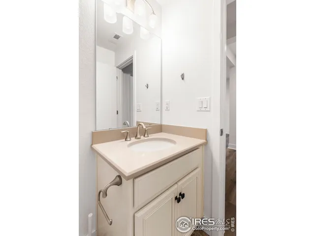 a view of a chairs and table on the roof deck