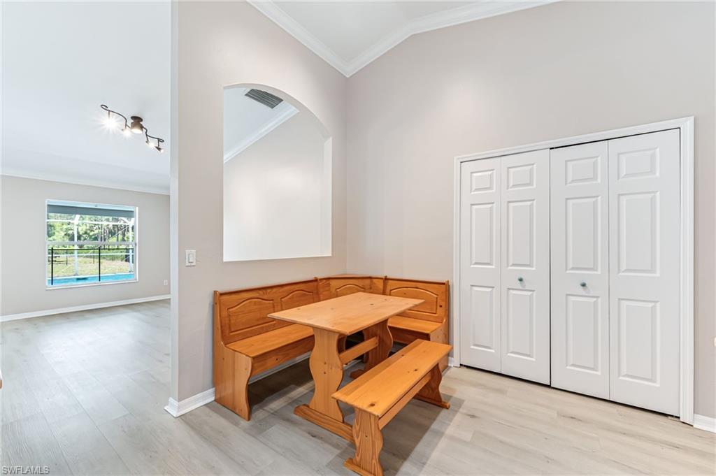 3630 10th Avenue Southeast Naples, FL 34117 - Photo 15 of 50 a room with a bed and wooden floor