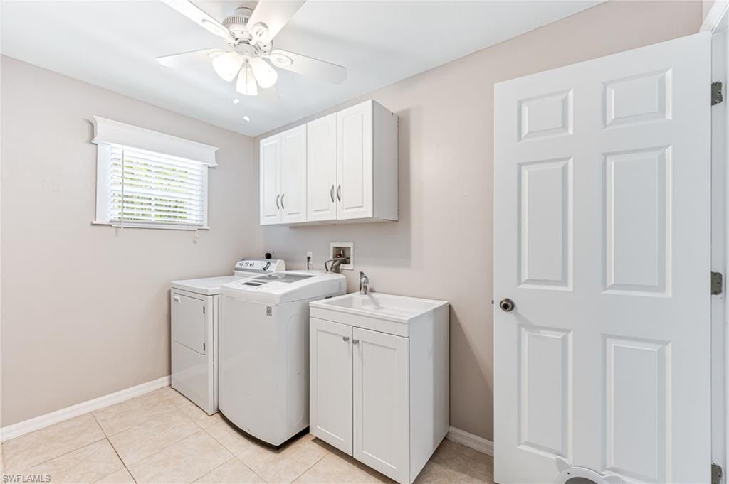 3630 10th Avenue Southeast Naples, FL 34117 - Photo 17 of 50 a view of a storage & utility room with closet dryer