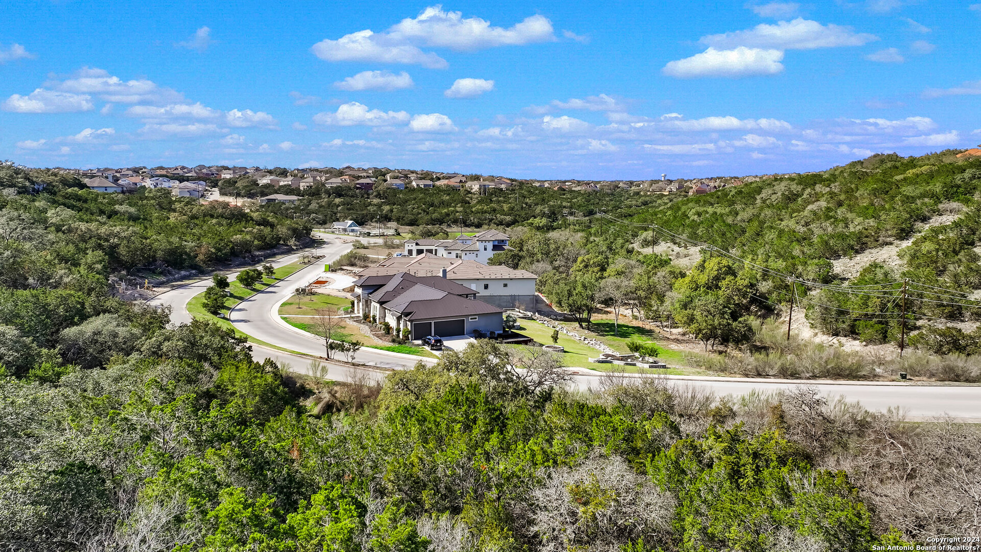 602 Winding Ravine San Antonio, TX 78258 - Photo 11 of 16 a view of a lake with outdoor space