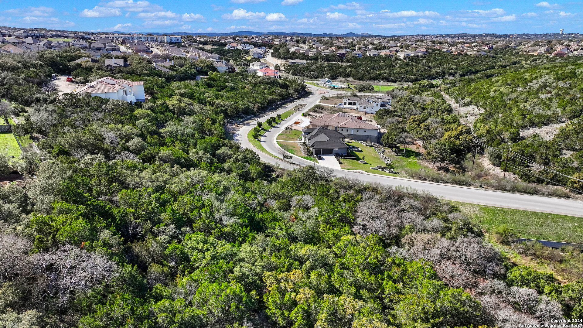602 Winding Ravine San Antonio, TX 78258 - Photo 7 of 16 an aerial view of a house with a yard