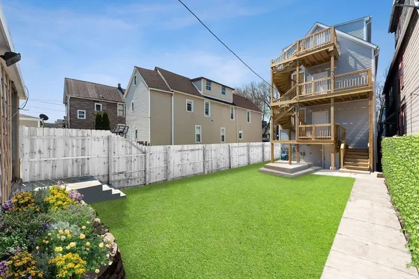 a view of a back yard of the house