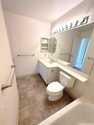 a bathroom with a sink a mirror and toilet