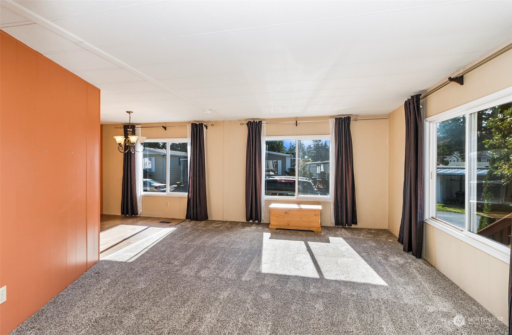 11622 Silver Lake Road, Unit 101 Everett, WA 98208 - Photo 12 of 40 a view of an empty room with window and kitchen view