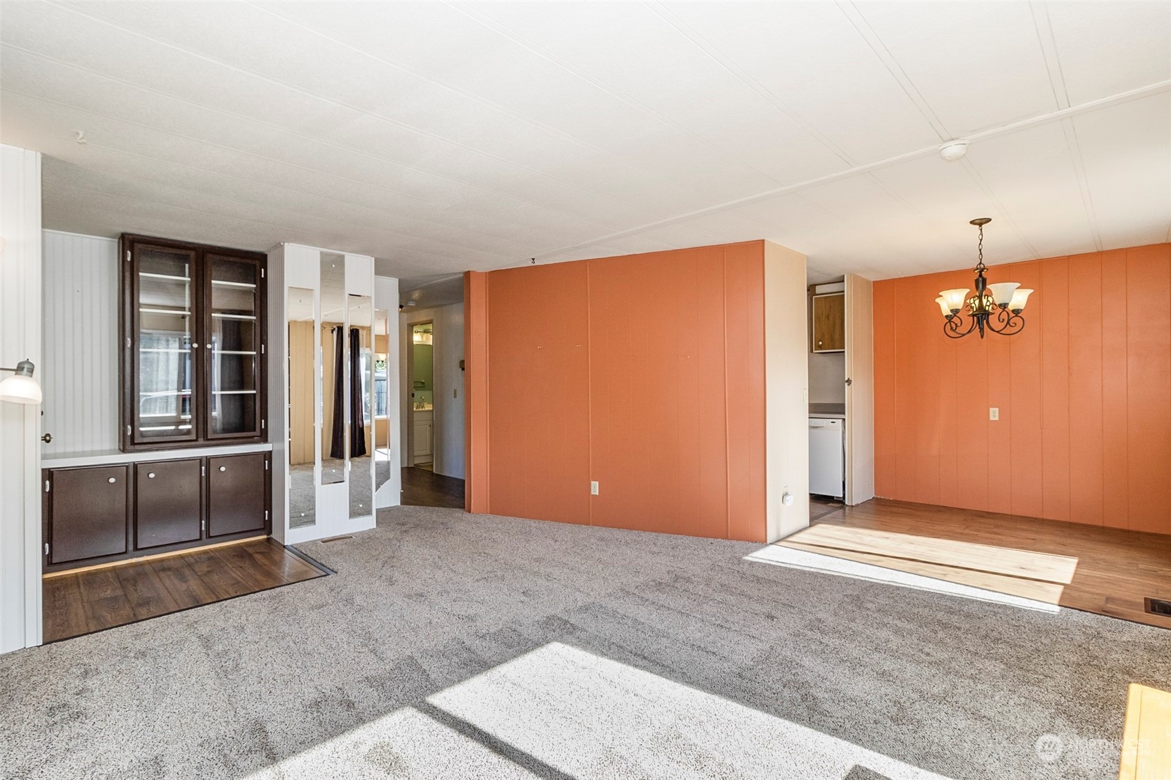 11622 Silver Lake Road, Unit 101 Everett, WA 98208 - Photo 17 of 40 an empty room with kitchen view and windows