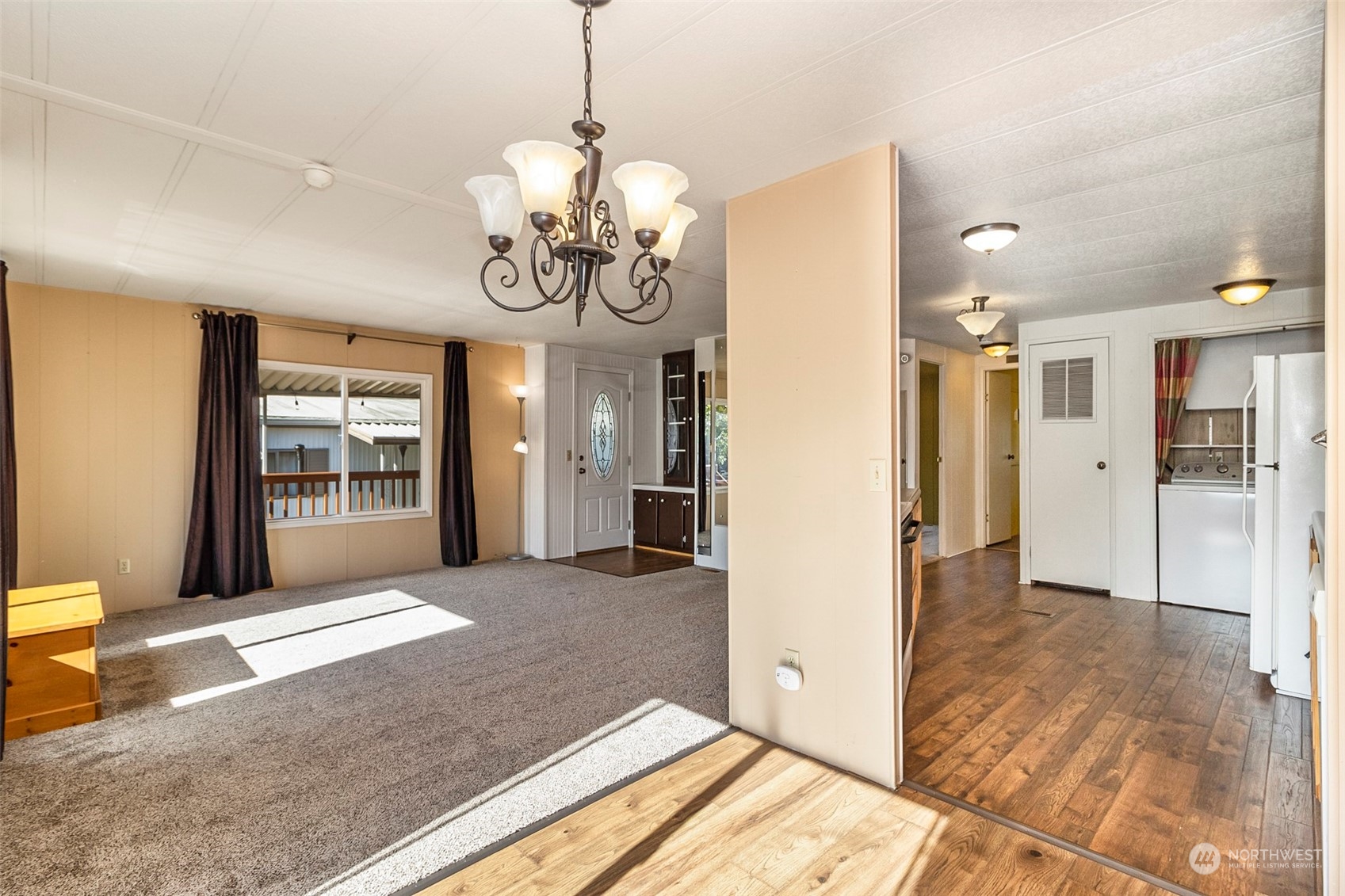 11622 Silver Lake Road, Unit 101 Everett, WA 98208 - Photo 22 of 40 a view of a livingroom with a chandelier