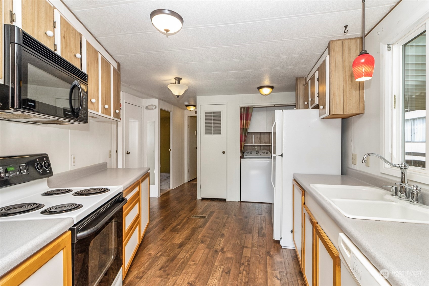 11622 Silver Lake Road, Unit 101 Everett, WA 98208 - Photo 23 of 40 a kitchen with stainless steel appliances granite countertop a sink stove and refrigerator