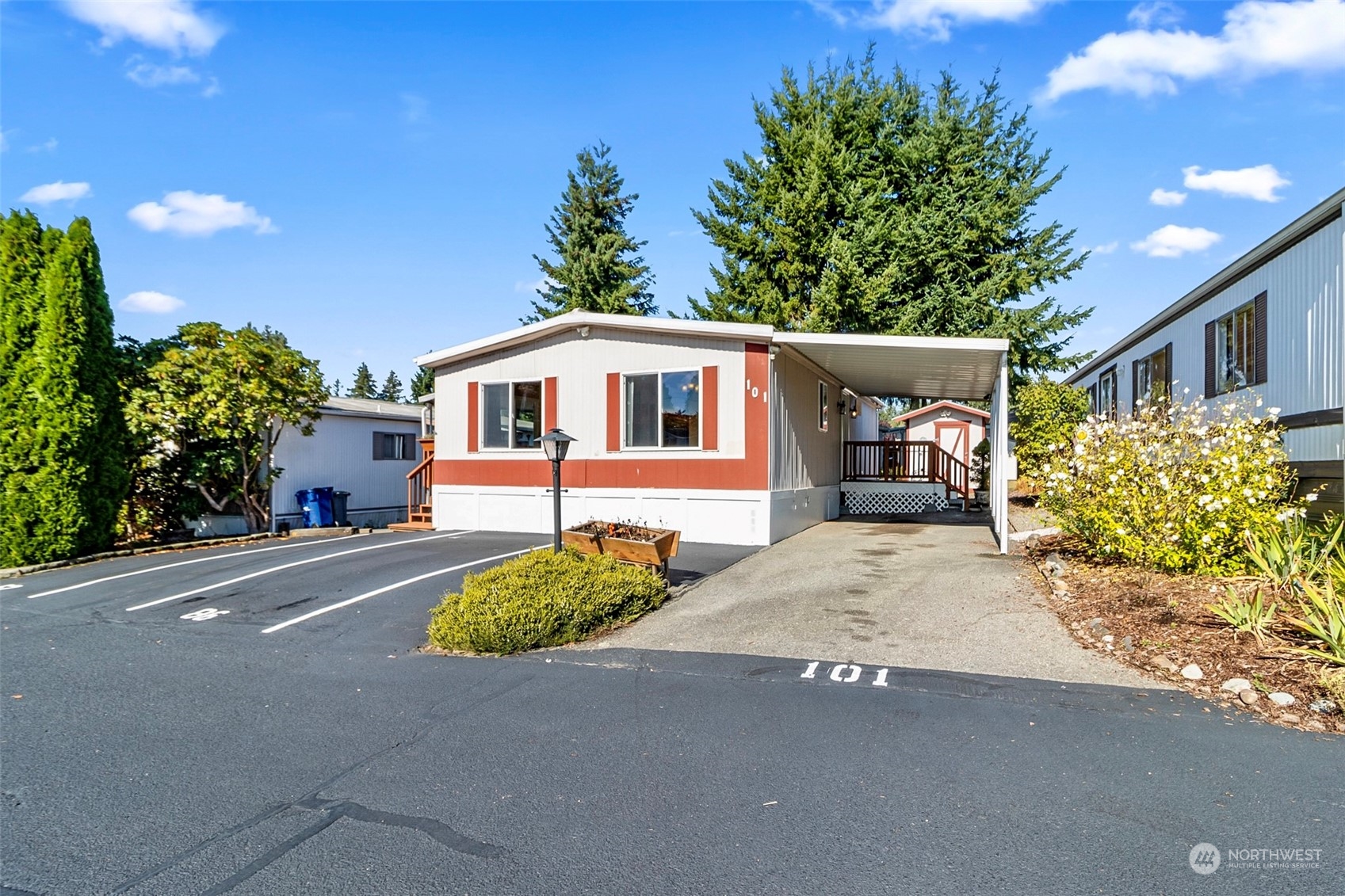 11622 Silver Lake Road, Unit 101 Everett, WA 98208 - Photo 3 of 40 a front view of a house with a yard