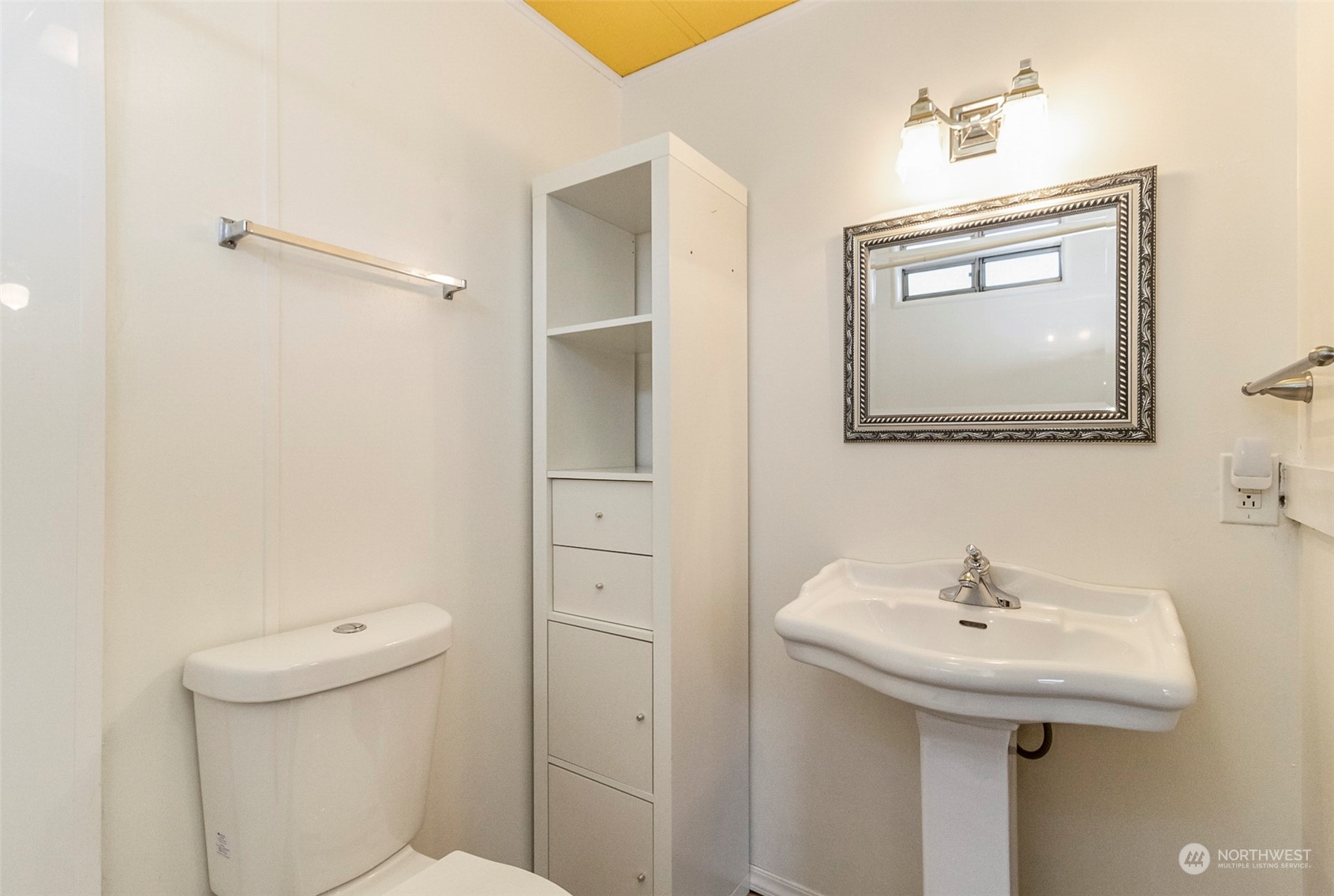 11622 Silver Lake Road, Unit 101 Everett, WA 98208 - Photo 33 of 40 a bathroom with a sink a toilet and mirror