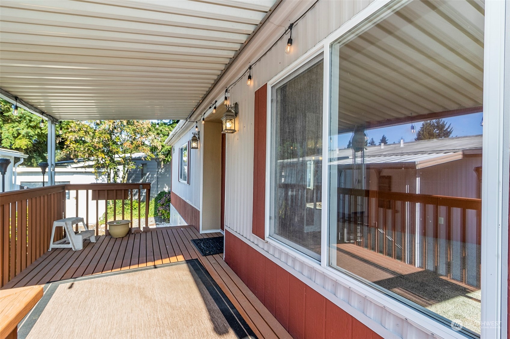 11622 Silver Lake Road, Unit 101 Everett, WA 98208 - Photo 5 of 40 a view of balcony with floor to ceiling window with wooden floor