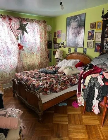 a bedroom with a bed and a couch