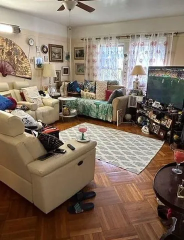 a living room with furniture and a large window