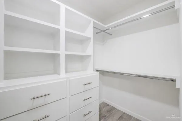 a view of an empty walk in closet