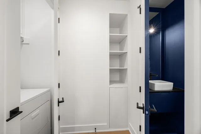 a kitchen that has a sink and a stove in it