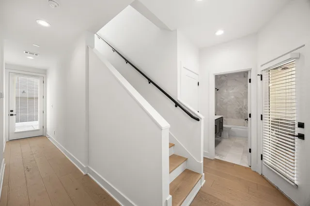 a view of entryway with wooden floor and stairs