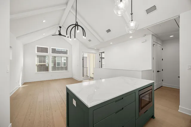 a kitchen that has a sink and a stove