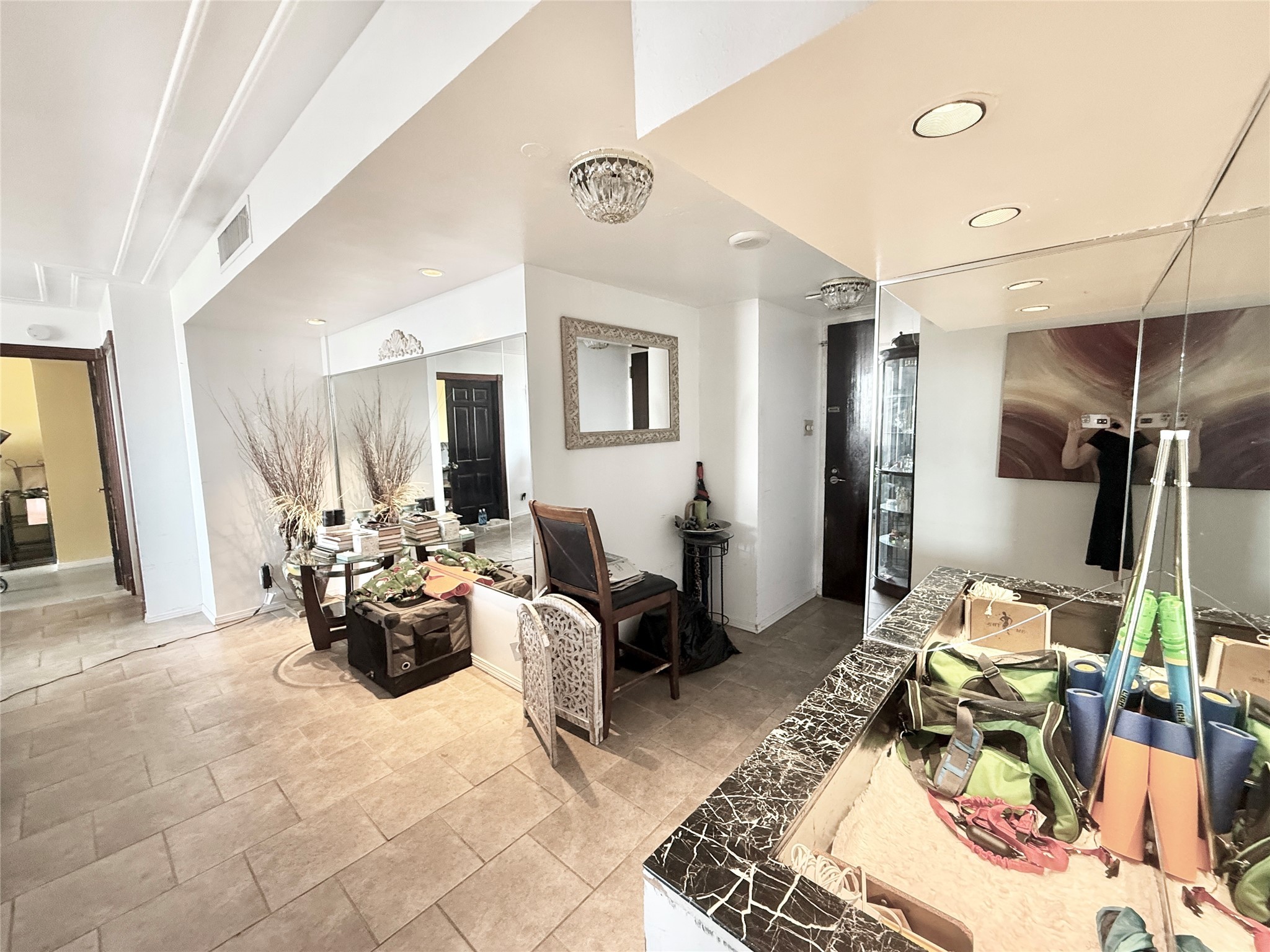 2016 Main Street, Unit 1704 Houston, TX 77002 - Photo 4 of 38 a living room with furniture fireplace and a chandelier