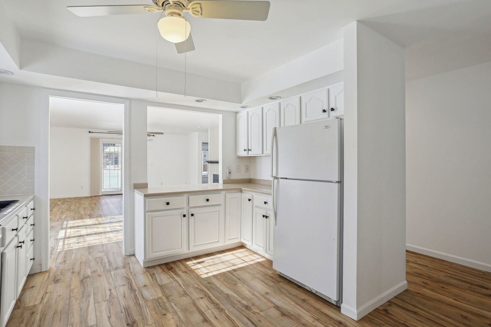 1731 Lakeside Drive, Unit B Champaign, IL 61821 - Photo 5 of 21 a kitchen with cabinets stainless steel appliances and wooden floor