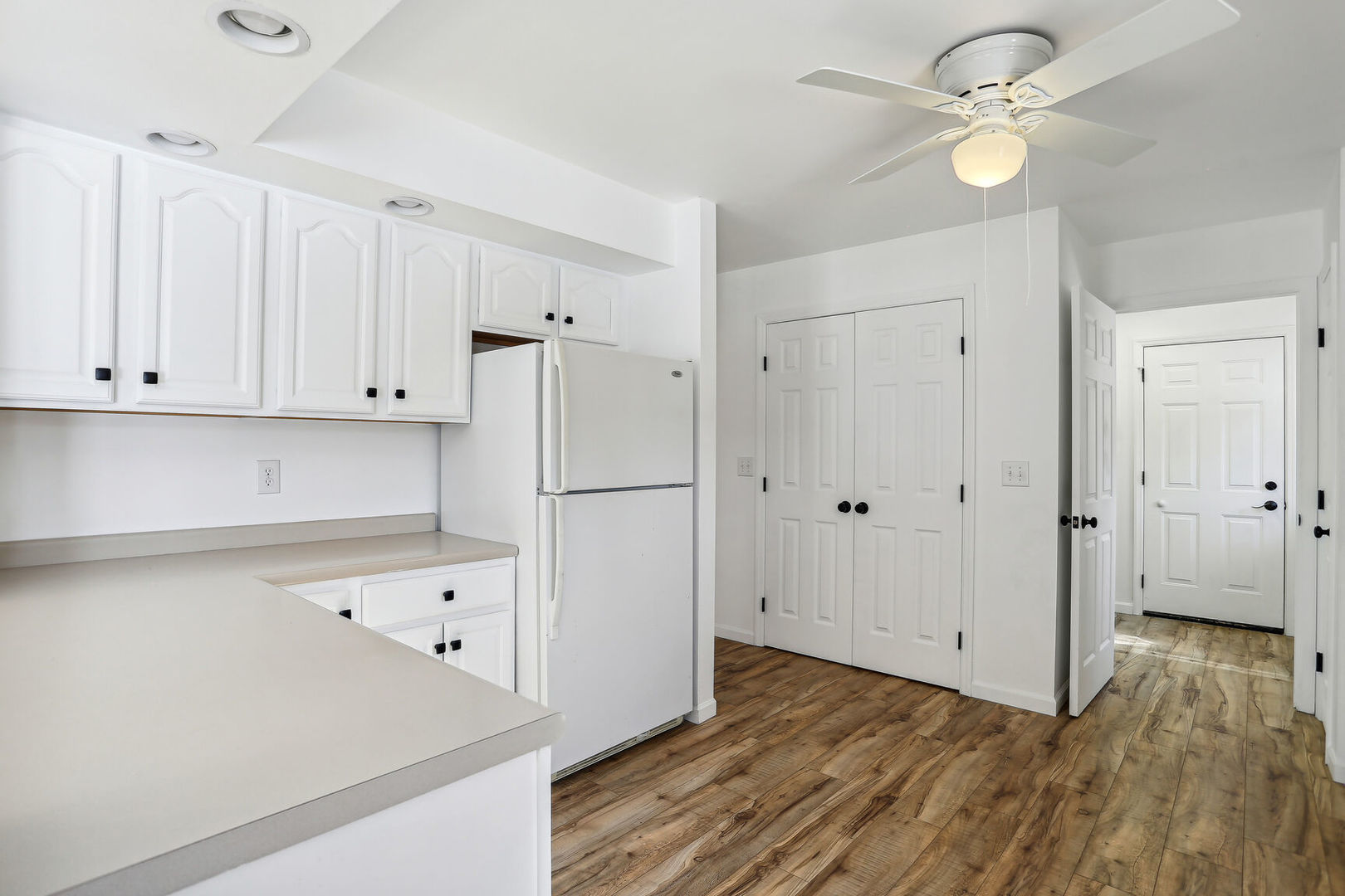 1731 Lakeside Drive, Unit B Champaign, IL 61821 - Photo 7 of 21 a view of kitchen with wooden floor and window