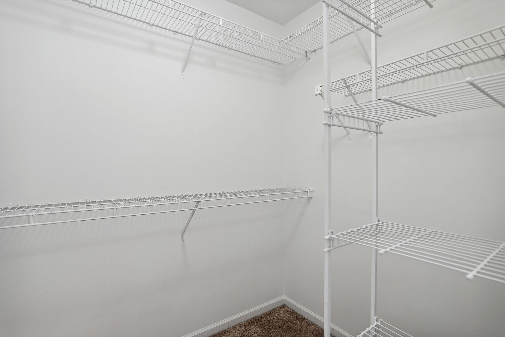 1731 Lakeside Drive, Unit B Champaign, IL 61821 - Photo 10 of 21 a view of a room with racks on the wall