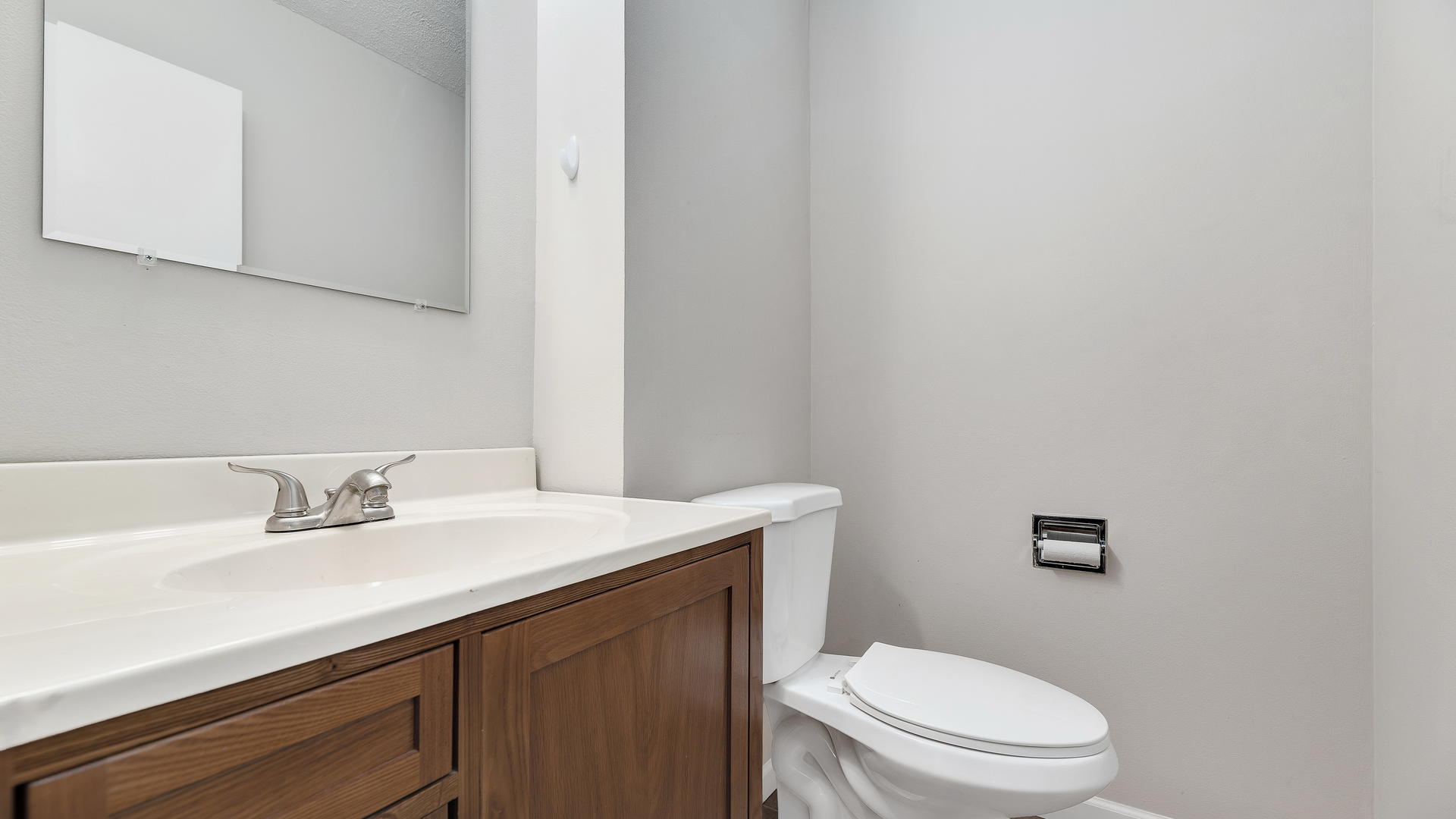792 Oregon Trail Roselle, IL 60172 - Photo 10 of 19 a bathroom with a sink a toilet and mirror