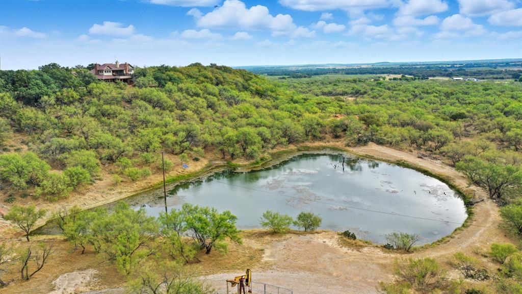 735 Gresham Lane Jacksboro, TX 76458 - Photo 33 of 40 a view of a swimming pool with a yard
