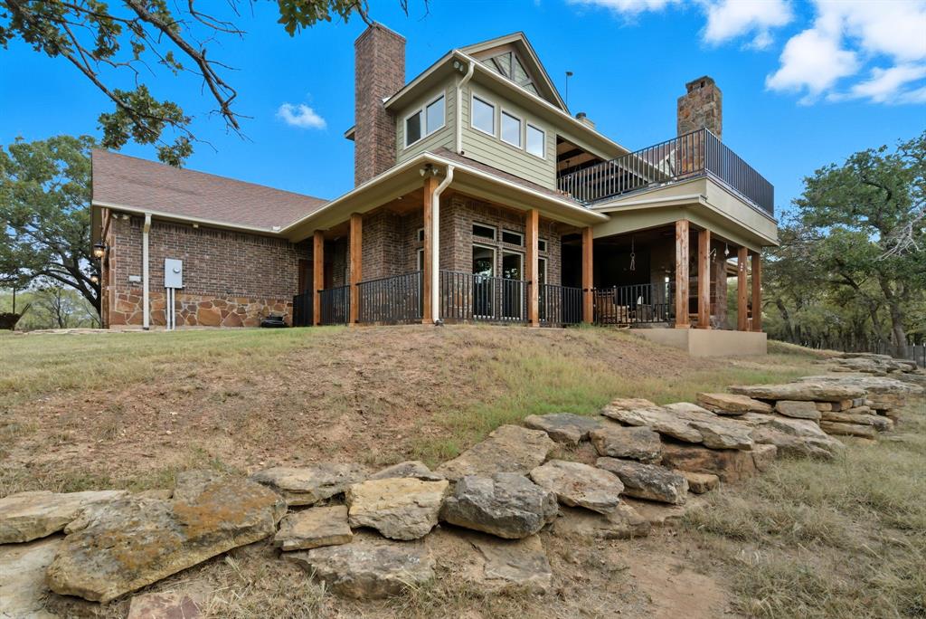 735 Gresham Lane Jacksboro, TX 76458 - Photo 4 of 40 a front view of a house with a yard