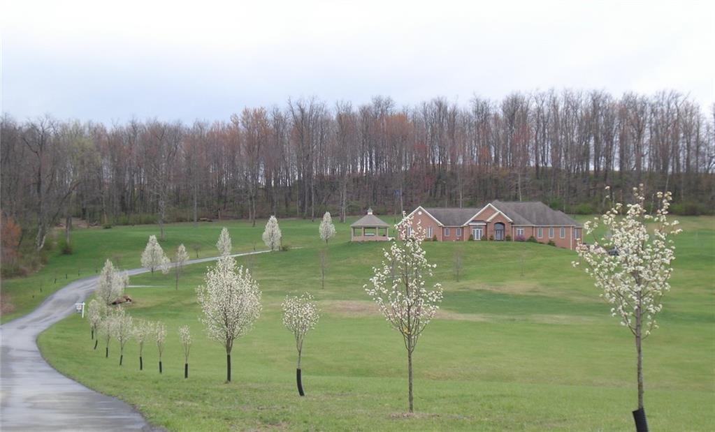 131 Malone Road Derry, PA 15627 - Photo 2 of 22 SPRINGTIME FLOWERING TREES LINE THE DRIVEWAY TO THIS GORGEOUS HOME