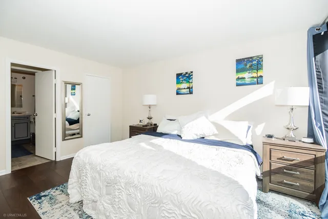 a bedroom with a bed and a view of bathroom