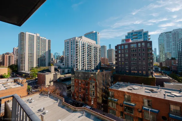 a large kitchen with a refrigerator and a stove