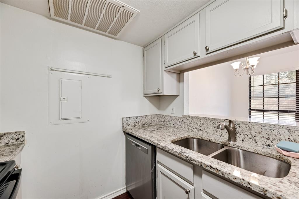 449 Harris Street, Unit 101L Coppell, TX 75019 - Photo 11 of 22 a view white cabinets and a sink